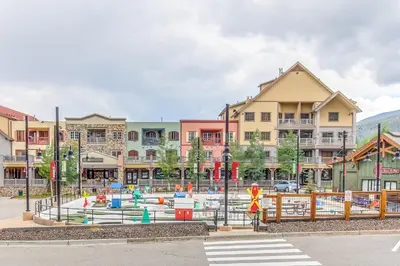 a playground in the middle of a city with buildings at Gateway 5059 in Keystone