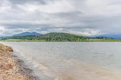 a body of water with trees in the background at Gateway 5059 in Keystone
