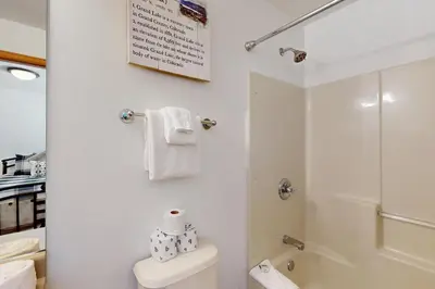 a bathroom with a toilet and a shower at Riverview Condo #5 in Grand Lake