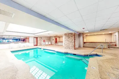 a swimming pool in a large room with a ceiling at Cozy Corner in Winter Park