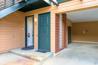 a front door of a house with a blue door at Riverside Retreat condo in Winter Park