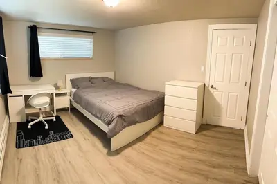 a bedroom with a bed and a desk and a bed sidx sidx sidx at Getaway Spot Close To Red Rocks, Denver & Mtns in Lakewood