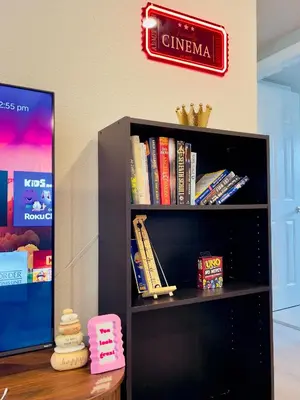 a black book shelf with books on it at Getaway Spot Close To Red Rocks, Denver & Mtns in Lakewood