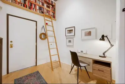 a room with a desk and a ladder and a chair at Loft Retreat - King Bed&Balcony - Pet-Friendly 30 in Denver