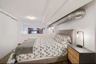 a white bedroom with a bed and a window at Loft Retreat - King Bed&Balcony - Pet-Friendly 30 in Denver