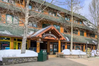 a building with snow on the front of it at Arapahoe Lodge-1BR and Murphy Condo -Kids Ski Free condo in Keystone