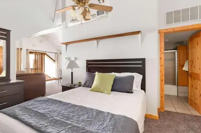 a bedroom with a bed and a ceiling fan at Studio at St Marys Glacier in Idaho Springs