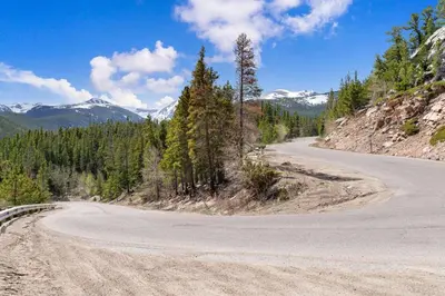 an empty road in the middle of a mountain at Studio at St Marys Glacier in Idaho Springs