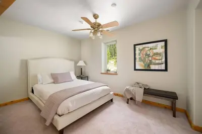 a bedroom with a bed and a ceiling fan at Summit Condo at St. Marys in Idaho Springs