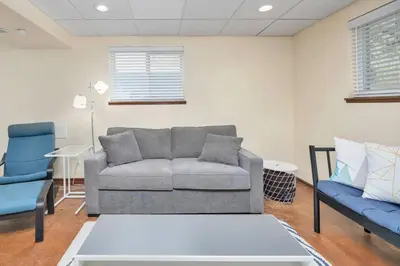 a living room with a couch and two chairs at The Lux in Lakewood. Minutes from Red Rocks. Hikes in Lakewood