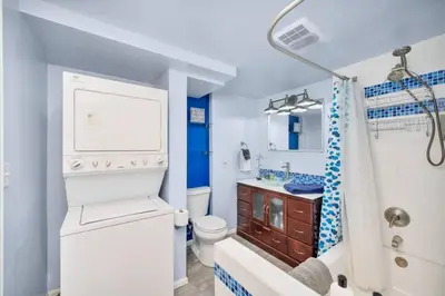 a bathroom with a toilet and a sink at The Lux in Lakewood. Minutes from Red Rocks. Hikes in Lakewood