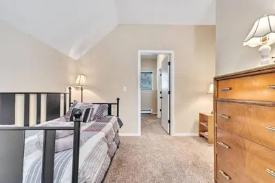 a bedroom with a bed and a dresser at King of the Mountain. Private Hot Tub. Pets allowe in Idaho Springs