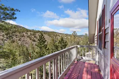a balcony with a view of the mountains at King of the Mountain. Private Hot Tub. Pets allowe in Idaho Springs