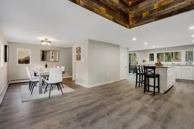 a dining room and kitchen with a table and chairs at Cabin by North Clear Creek. Private Hot Tub. Pets in Black Hawk