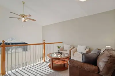 a living room with a couch and a table at The Golden Townhouse Walk to downtown Pets Welcome in Golden