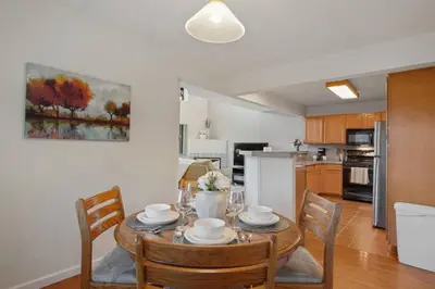 a kitchen and dining room with a table and chairs at The Golden Townhouse Walk to downtown Pets Welcome in Golden