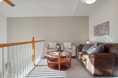 a living room with a couch and a table at The Golden Townhouse Walk to downtown Pets Welcome in Golden