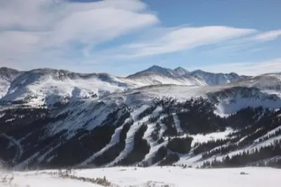 a snow covered mountain range with trees and mountains at The Golden Townhouse Walk to downtown Pets Welcome in Golden