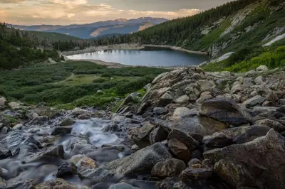 a mountain river with rocks and a lake at The Golden Townhouse Walk to downtown Pets Welcome in Golden
