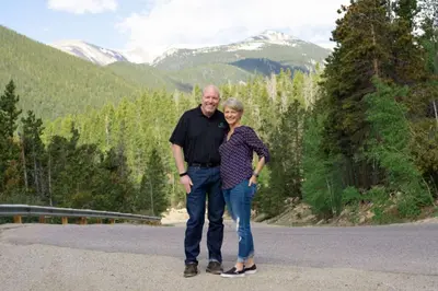 a man and a woman standing in the middle of a road at New Classic Comfortable Rino Escape. Pets Welcome in Denver