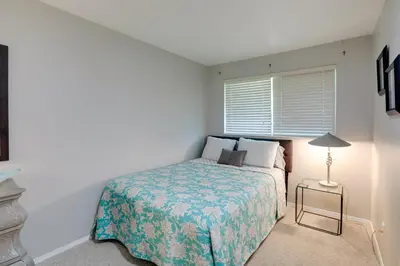 a small bedroom with a bed and a lamp at Stress-Free Commuting! Extended Stay in Littleton in Littleton