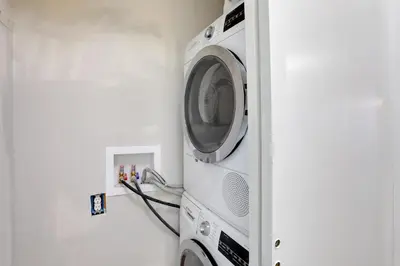a washer and dryer in a room at Stress-Free Commuting! Extended Stay in Littleton in Littleton