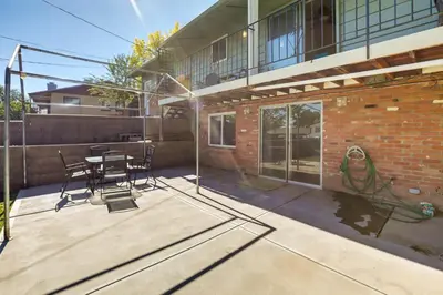 a patio with a table and chairs in front of a building at Stress-Free Commuting! Extended Stay in Littleton in Littleton