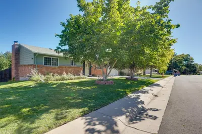 a house with a tree on the side of the road at Stress-Free Commuting! Extended Stay in Littleton in Littleton