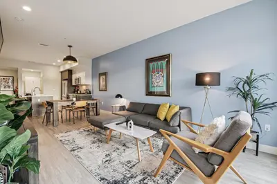 a living room with a couch and a table at The Espadin LoHi Collection in Denver