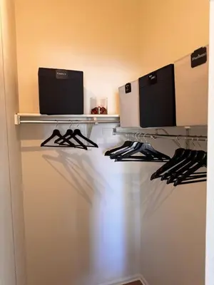 a closet with two computer monitors on a shelf at Beautifully Renovated OneBedroom Apt with Two Beds in Littleton
