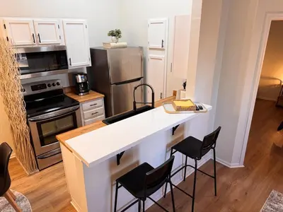 a kitchen with a white counter top and appliances at Beautifully Renovated OneBedroom Apt with Two Beds in Littleton