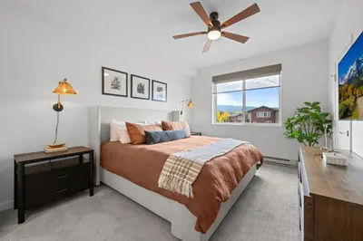 a bedroom with a bed and a ceiling fan at 301 W Meadow Mile #3 in Fraser