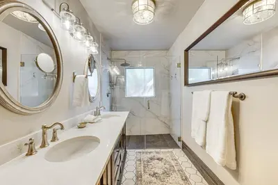 a bathroom with a sink and a mirror at Downtown Walkability - The Purple House in Berthoud