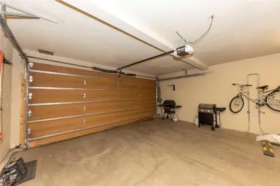 a garage with a garage door and a bike on the wall at 24 Autumn Brook townhouse in Dillon