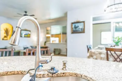 a kitchen sink with a faucet on a counter at Free Night! Movies, Games & BBQ|25 mins>DT Denver in Brighton