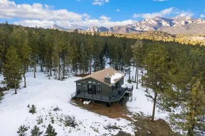 an aerial view of a house in the snow at New The Pine Getaway Lots of Room Hot Tub Views in Pine