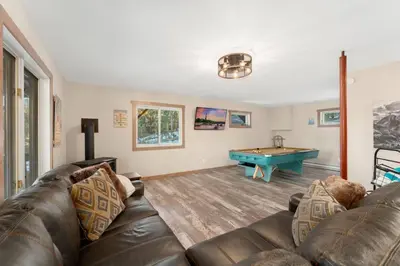 a living room with a couch and a pool table at New The Pine Getaway Lots of Room Hot Tub Views in Pine