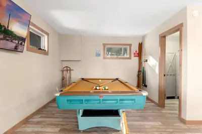 a ping pong table in a room with ahibition at New The Pine Getaway Lots of Room Hot Tub Views in Pine