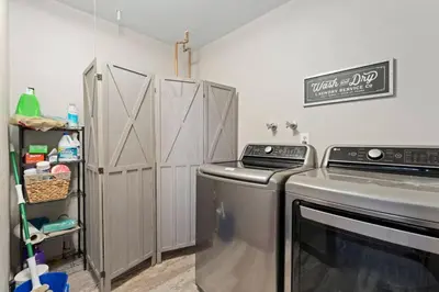 a laundry room with a stove and a washer at New The Pine Getaway Lots of Room Hot Tub Views in Pine