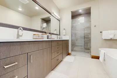 a bathroom with a sink and a shower at Lakota Northwoods Luxury Villa 308 in Winter Park