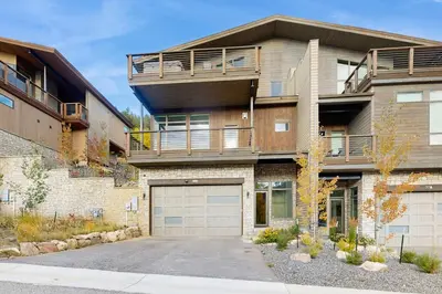 a large apartment building with a garage at Lakota Northwoods Luxury Villa 308 in Winter Park