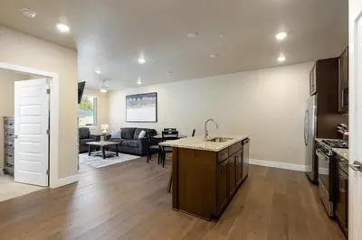 a kitchen and living room with a sink and a table at 1 bedroom apartment free electric charger Keystone in Keystone