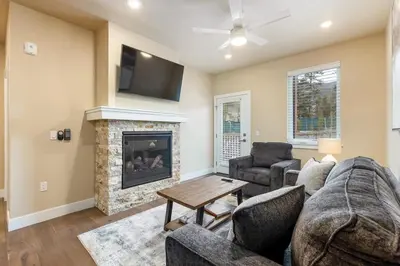 a living room with a couch and a fireplace at 1 bedroom apartment free electric charger Keystone in Keystone