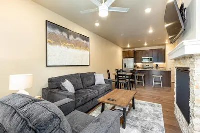 a living room with a couch and a table at 1 bedroom apartment free electric charger Keystone in Keystone