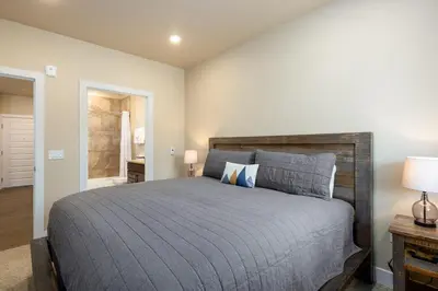 a bedroom with a large bed in a room at 1 bedroom apartment free electric charger Keystone in Keystone