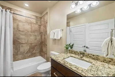a bathroom with a sink and a tub and a toilet at 1 bedroom apartment free electric charger Keystone in Keystone