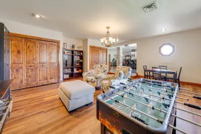 a living room with a pool table in it at Loveland Peaks Retreat Family Home 3 Mi to Dtwn! in Loveland
