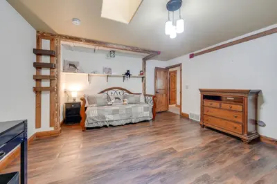 a bedroom with a bed and a dresser at Loveland Peaks Retreat Family Home 3 Mi to Dtwn! in Loveland