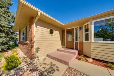 a home with stairs leading to the front door at Loveland Peaks Retreat Family Home 3 Mi to Dtwn! in Loveland
