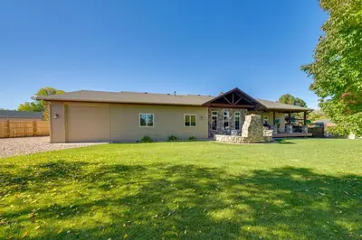 a house with a large lawn in front of it at Loveland Peaks Retreat Family Home 3 Mi to Dtwn! in Loveland